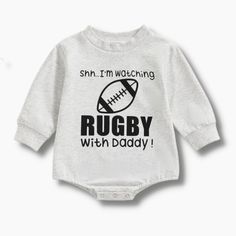 Grab this fun long sleeve baby romper for the next baby shower or rugby lover! This romper is made specifically with the rugby lover's kid in mind. This romper will get everyone excited for the rugby season and remind the rugby player how much they are loved by the whole family. Material: Cotton, Polyester Casual Onesie With Letter Print For Game Day, Long Sleeve Onesie With Letter Print For Playtime, Playful Long Sleeve Onesie With Letter Print, Sporty Cotton Long Sleeve Onesie, Sporty Long Sleeve Cotton Onesie, Casual Long Sleeve Onesie With Graphic Print, Casual Long Sleeve Graphic Print Onesie, Rugby Puns, Rugby Baby