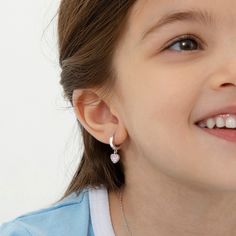 These dangle cubic zirconia earrings for little girls are adorable for the little heart lover in your life. These adorable girl's earrings are crafted entirely in 925 sterling silver, a naturally HYPOALLERGENIC fine metal, making it safe for sensitive ears. They feature a 12mm safety hoop design with a CZ-covered heart dangle charm. These toddler & young girl earrings make a perfect gift for any occasion as well as for everyday fashion. A complimentary gift box is included for easy giving! Heart Hoop Earrings, Hoop Design, Puffed Heart, Cubic Zirconia Earrings, Zirconia Earrings, Girly Jewelry, Dangle Charms, Girls Earrings, Sensitive Ears