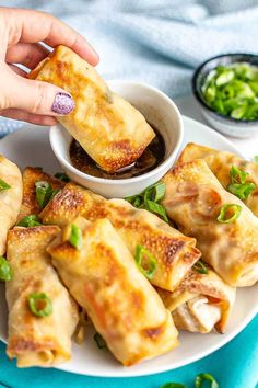 vegetable egg rolls on a plate with dipping sauce