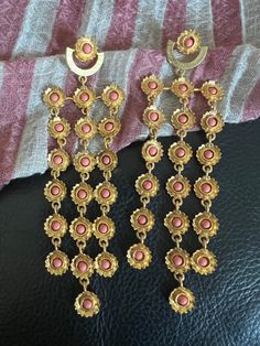 Handcrafted in brass and Coral gemstones, gold plated One of a kind jewelry piece. Will be a standout. The weight of the earring is 34 g per pair. Coral Flowers, Designer Earrings, Flower Earrings, Statement Earrings, Jewelry Pieces, Coral, Jewelry Earrings Dangle, Etsy Earrings, Dangle Drop Earrings