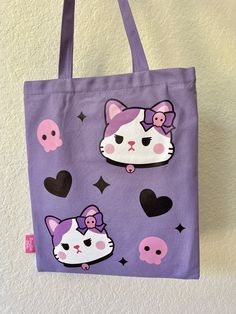 This adorable tote bag has designs on both sides. It's perfect for everyday use! Kuromi inspired 💜 Item Details: ♡Heat transfer printed front and back designs♡Pocket with zipper for phone and key♡Zipper on the top of the bag♡Length 34 x Height 40 cm♡Handle 2.5 x 56 cm How to care: Gentle wash with water, please avoid using harsh detergents and soaps. Trendy Bags With Cartoon Print For Daily Use, Trendy Cartoon Print Bags For Daily Use, Cute Bags With Cartoon Print For Everyday Use, Cute Cartoon Print Bags For Everyday Use, Cute Everyday Bags With Cartoon Print, Pink Cartoon Print Bag For Everyday Use, Cute Rectangular Bag With Cartoon Print, Cute Rectangular Bags With Cartoon Print, Pink Bags With Cartoon Print For Daily Use