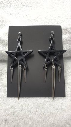 Looking for something with a witchy vibe? Then these black pentagram earrings are the right thing for you.  - Resin cast black pentagram, approximately 50 mm wide  - Buckles and studs are made of stainless steel, so they are suitable for those who are allergic to nickel  - Acrylic spike, 50 mm long  - Acrylic spikes, 24 mm long You can choose safety clips from stainless steel or silicone.  You can fit them into any outfit and these are some of the ideas: They will look great on a tight gothic dress, a wide grunge vest or a shirt. Complete your witchy Wiccan with these beautiful earrings.  I am at your service for all information.  Thank you for your interest in my work and support.  Follow me on the social networks listed below.  Facebook: www.facebook.com/KalitheaAlternativeAccessories  I Black Gothic Earrings, Black Metal Earrings For Alternative Fashion, Nickel Free Black Alternative Earrings, Alternative Style Nickel-free Black Earrings, Black Pierced Earrings For Alternative Fashion, Alternative Style Black Nickel-free Earrings, Black Earrings For Alternative Fashion, Alternative Style Black Earrings For Gift, Black Punk Metal Earrings