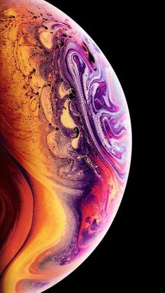 the iphone xr is shown in this close up photo, with an orange and purple swirl