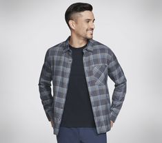 Comfort and style combine in the essential Skechers GO DRI Ridgetop Button Down Shirt. This plaid shirt features our GO DRI fabric, long sleeves, front chest pocket, classic collar, and a button front closure. | Skechers Men's GO DRI Ridgetop Button Down Shirt | Skechers GO DRI fabric has moisture-wicking, quick-drying, and UPF 40+ properties | Classic Fit | 51% Modal, 49% Cotton | Front chest pocket | Plaid long sleeve silhouette | Classic collar | Skechers flag Cold Weather Hats, Sleeve Silhouette, Plaid Shirt Men, Waterproof Shoes, Skechers Women, Men's Apparel, Black Charcoal, Pants Outfit, Plaid Shirt