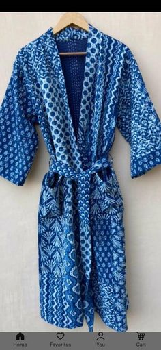 This Kimono is made of hand Kantha stitch fabric in patchwork . The fabric is a handmade printed fabric. Kantha stitch over the fabric gives it a unique look. It is two Layer of Cotton Kantha Stitch (Hand Quilted) Fabric Robe Size : Free size Length: 50 Inch ( 125 Cms.). Blue Long Sleeve Sleepwear For Vacation, Cotton Robe For Beachwear And Loungewear, Cotton Beachwear Robe For Loungewear, Blue Summer Kimono For Home, Summer Blue Kimono For Home, Fitted Cotton Robe For Daywear, Blue Long Sleeve Robe For Sleep, Blue Long Sleeve Sleep Robe, Blue Cotton Sleep Kimono