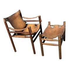 two wooden chairs sitting next to each other