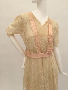 Here is a very pretty antique Edwardian cream layered lace dress with beautiful pale pink silk ribbon decoration to the bodice, waist and back of the dress. There are faux pearl embellishments to each sleeve and to the front of the skirt and bodice. The dress fastens with hooks and eyes. When laid flat the measurements are:Length: 52.5" inchesFrom underarm to underarm across: 17" inchesAcross the waist: 14.5" inchesAcross the hips: 18" inchesSleeve length: 11" inches measured from the shoulder s Layered Lace Dress, Pink Silk Ribbon, Ribbon Decoration, Lace Panel Dress, Ribbon Decorations, Panel Dress, Tennis Dress, Vintage Lingerie, Lace Panelled