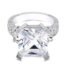 an engagement ring with a princess cut diamond in the center and pave set shoulders