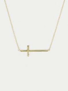 This delicate gold cross necklace is perfect for everyday wear! The dainty cross and chain make it easy to keep on and style with any outfit! Gold Cross Necklace With Delicate Chain For Everyday, Everyday Gold Cross Necklace With Delicate Chain, Everyday Cross Charm Necklace With Clavicle Chain, Minimalist Cross Necklace With Delicate Chain Crucifix, Minimalist Crucifix Cross Necklace With Delicate Chain, Everyday Cross Necklace With Clavicle Chain, Simple Cross Necklace With Delicate Chain, Everyday Clavicle Chain Cross Necklace, Everyday Cross Charm Necklace With Adjustable Chain