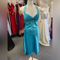 Beautiful Satin Gown In Turquoise Made By Bora. It Is A Halter Style With The Rhinestones And Beading On The Bodice And Halter Straps. Rouched Chiffon Criss Crossed Neckline. Very Elegant, Cute, And Sassy. This Is Nwt. Elegant Sleeveless Turquoise Dress, Blue Halter Neck Dress For Prom Season, Blue Halter Neck Dress For Prom, Blue Halter Neck Evening Dress For Prom, Fitted Turquoise Evening Dress For Prom, Turquoise Fitted Evening Dress, Turquoise Fitted Evening Dress For Prom, Elegant Fitted Turquoise Gown, Turquoise Fitted Prom Evening Dress