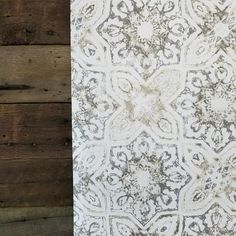 a white and grey wallpaper with wood planks in the backgroung