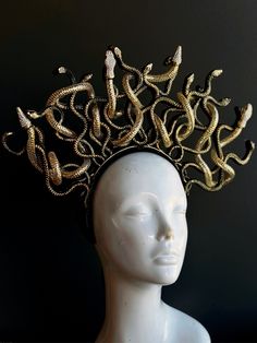 Medusa headpiece embellished with gold and black shade painted snakes! C U S T O M I Z A T I O N Can be customized further, get in touch for custom orders! S I Z E  Adult size. S H I P P I N G -  Processed same day or within 24 hours.  1-2 day guaranteed delivery, add item to cart, click shipping tab for rates.  Pls leave a check out note with your need date & contact number  Msg for delivery time frames (Include your state/country) C O N T A C T  Please contact us via ETSY messages. P H O T O Snake Headdress, Snake Headband, Medusa Halloween Costume, Medusa Headpiece, Medusa Snake, Medusa Costume, Golden Snake, Metal Mask, Ancient Mythology