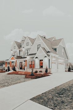 a large white and blue house with lots of windows