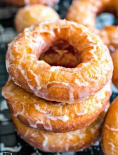 several glazed donuts stacked on top of each other