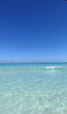 an ocean view with clear water and blue sky