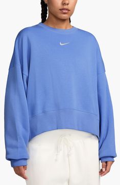 An embroidered Swoosh adds minimal branding to this cozy fleece sweatshirt cut for a relaxed, oversized fit that's enhanced by the dropped shoulders. 22" length (size Medium) Crewneck 80% cotton, 20% polyester Machine wash, tumble dry Imported Nike Phoenix Fleece, Nike Crew Neck, Vintage Nike Sweatshirt, Nike Sportswear Tech Fleece, Minimal Branding, Cut Sweatshirts, Nike Sweatshirts, Tech Fleece, Blue Sweatshirt