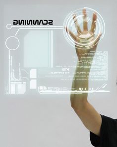 a man holding his hand up in front of a screen with the word scanning on it