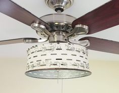 a ceiling fan that is hanging from the ceiling