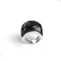 This sterling silver cocktail ring features a beautiful patterned piece of gorgeous black onyx stone. I designed a simple and modern setting to showcase this beautiful stone. The shimmering, fancy-cut, and multi-faceted onyx will showcase your confidence and fashion consciousness. :) Gemstone: Black Onyx  Stone size: 15 mm. wide Metal - sterling silver  Finish - high polish All pieces purchased from Silver Sand Jewelry come ready for gift-giving. :)   *Shipping on all items is within 1-2 days of Modern Dome Ring With Gemstone, Modern Black Dome Ring As A Gift, Elegant Black Dome Ring With Polished Finish, Modern Black Dome Ring Gift, Modern Black Dome Ring, Elegant Black Oval Dome Ring, Black Faceted Rings For Formal Occasions, Formal Black Dome Ring With Polished Finish, Sand Jewelry