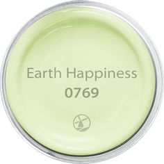 an image of the earth happiness logo on a green plate that says earth happiness 0769