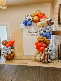 balloons are arranged in the shape of a football wreath