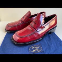 Rare Vintage Men’s Prada Red Leather Penny Loafers Eu Size 7.5 Is Size 9. Gorgeous Deep Cherry Color With Perfect Shine. Leather Is In Excellent Condition With Little Wear To Soles. Comes With Original Box, Certificate Of Authenticity, And Flannel Polishing Cloth. From A Smoke Free Environment. Please Ask Questions Prior To Purchasing As All Sales Are Final. Prada Shoes Men, Prada Red, Cherry Color, Prada Shoes, Penny Loafers, Loafer Shoes, Red Leather, Vintage Men, Penny