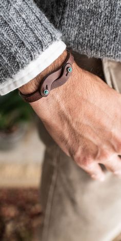 a close up of a person wearing a bracelet