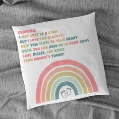 a pillow that has a rainbow on it with the words grandma, may be a bump but i love you already keep this close to your heart