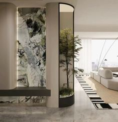 an elegant living room with marble walls and flooring is seen in this image from the entrance