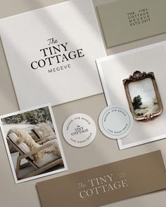 the tiny cottage logo and business cards are displayed on top of a table with other items