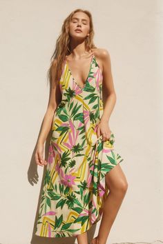 -Color: Banana Cream/Pink -Maxi dress with a plunging halter neckline -Exaggerated flared skirt -Adjustable X shape shoulder straps and tie string details on the back -Unlined -Prefect as a swimsuit cover-up -Content: 100% Rayon -Imported -Model is 5'10" and wearing size Small Tropical Print Maxi Dress, Tropical Maxi Dress, Pink Maxi, Banana Cream, Maxi Robes, Backless Maxi Dresses, Halter Maxi Dresses, Tiered Maxi Dress, Pink Maxi Dress