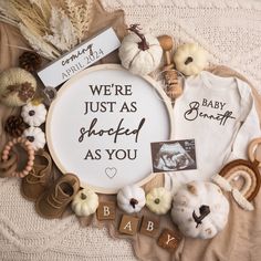 there is a baby's birth announcement surrounded by other items