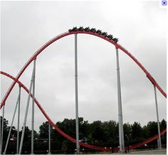 the roller coaster is very tall and red