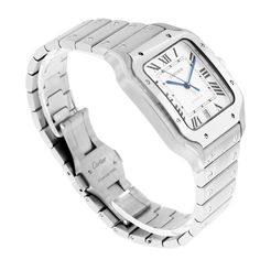 Description Guaranteed Authentic Brand-New Men' Cartier Santos Collection with a 40mm stainless steel case. This fine timepiece is brand-new and features a silver dial with Roman numerals, automatic movement, and a stainless steel bracelet. Extra leather strap. The watch comes with a Two Year Warranty from Da Vinci Fine Jewelry, Inc., a Cartier box, Cartier certificate, instructions, and Certified Retail Appraisal from Da Vinci Fine Jewelry, Inc. Take advantage of this great deal today! Details Classic Silver Automatic Watch, Luxury Silver Automatic Watch, Silver Luxury Automatic Watch, Luxury Automatic Silver Watch, Swiss Luxury Watches, Swiss Luxury, Cartier Santos, Roman Numerals, Steel Bracelet