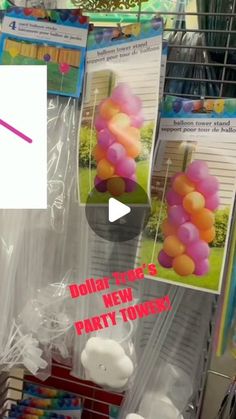 there are balloons and candles on display in the store for $ 1 00 per pound