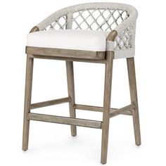 an upholstered bar stool with white cushions and wood frame, in front of a white background