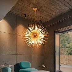 a living room filled with furniture and a starburst light hanging from the ceiling