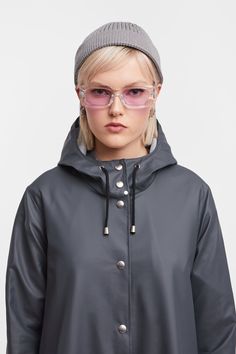 Mosebacke Lightweight Raincoat Charcoal | STUTTERHEIM US Long Raincoat With Adjustable Hood For Outdoor, Winter Raincoat With Button Closure, Winter Outdoor Raincoat With Button Closure, Outdoor Long Raincoat With Adjustable Hood, Gray Hooded Raincoat For Fall, Liquid Laundry Soap, Raincoats For Women, Waterproof Fabric, Metal Buttons