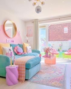 the living room is decorated in pastel colors