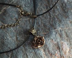 "Minimalist necklace with sculpted bronze rose. Material of rose is polymer clay with using gold leaf. Each petal of flower made by hand Dia flower about 15 mm/ 0.55 \" Length of necklace is adjustable: 18-20 inches/ 45,5- 50.8 cm If you need other length of necklace let me know and I will make it for you. Polymer clay isn't afraid of water, strong and non-toxic. Gorgeous gift for women and girls as handmade item ALL CHOKERS - https://www.etsy.com/shop/BuduartJewelry?ref=simple-shop-header-name& Adjustable Rose Gold Pendant Charm Necklaces, Adjustable Rose Gold Pendant Charm Necklace, Bronze Flower-shaped Jewelry Gift, Copper Flower Pendant Necklace As Gift, Adjustable Gold Rose Design Jewelry, Minimalist Bronze Necklaces For Gifts, Bronze Minimalist Necklace For Gift, Minimalist Bronze Necklace For Gifts, Adjustable Rose Gold Flower Pendant Necklace