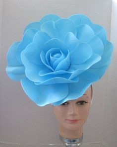 "*  This large smooth turquoise open faced flower has a diameter of 13\" when it is fully expanded. *   The flower sits off to the right side of the head and is tilted forward for a more dramatic look.  The tilt can be adjusted by wearing the band further back on the head. *  The back of the flower has a puff of pale turquoise colored feathers that makes the design closer to a custom piece of work. *  It has been made on a white satin covered acrylic headband that offers great support and stabil Flower Hat, Pale Turquoise, Alice In Wonderland Costume, Wonderland Costumes, Flower Fascinator, Crown Hat, Crazy Hats, Turquoise Flowers, Dramatic Look