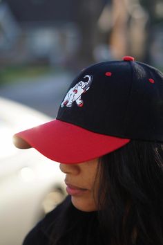 With unique designs you won't find anywhere else, our caps are the quality type that are designed with a thicker woven fabric. Not those flimsy weak ones that lose shape. 6-Panel. 100% stitched embroidered design. Curved brim. Dry clean only. Comes in: Velcro Adjust back. Perfect for those Devastating Divas who need a cap for all casual, sports and/or fitness occasions. Black Embroidered Logo Baseball Cap, Black Embroidered Cotton Trucker Hat, Black Cotton Fitted Hat With Curved Visor, Black Cotton Fitted Hat, Black Cotton Fitted Hat, One Size, Black Cotton Fitted Hat With Curved Bill, Embroidered Black Baseball Cap, Black Embroidered Fitted Cap, Embroidered Black Fitted Cap