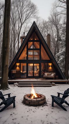 a cabin with a fire pit in the snow