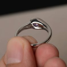 This is a gorgeous handmade creation. Its beauty is its simplicity & Elegance. The 5*7 mm oval shape faceted natural amethyst is crafted in solid sterling silver and with rhodium plated. All item is sent in a beautiful gift box If you have any idea of design your ring,pls contact me directly. You can realize more lovely stuff clicking the link https://www.etsy.com/shop/knightjewelry?refshopsection_shophome_leftnav Please leave the correct address and you phone number for delivering successfu Fine Jewelry Amethyst Ring With Polished Finish, Oval Amethyst Ring With Polished Finish For Anniversary, Oval Solitaire Amethyst Ring Gift, Oval Amethyst Rings With Polished Finish, Oval Solitaire Amethyst Promise Ring, Oval Birthstone Ring With Tension Setting For Gift, Gift Oval Birthstone Ring With Tension Setting, Oval Amethyst Birthstone Ring With Bezel Setting, Modern Amethyst Promise Ring