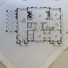 a drawing of a floor plan on top of a piece of white paper with black ink