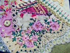 a close up of a piece of cloth with flowers on it and buttons in the middle