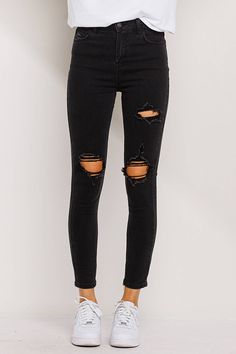 These black high rise skinny jeans are a must for your closet! With distressing in the knees, as well as the mid thigh, these jeans resemble the classic skinny jeans but with the jelly twist. Closure: Button and zipper. Five pockets. Distressing throughout. Black. Clean cut hem. Stretch. RISE: 10 1/2" INSEAM: 27" Model is 5'10 and wears a size 3 / 26 or size S Wripped Black Jeans, High-rise Black Ripped Jean Shorts, Fitted Ripped Washed Black Jeans, Washed Black High Rise Ripped Jeans, Stretch Ripped Black Jeans, Distressed Black Jeans, Black Crop, Black Skinnies, Knee Length