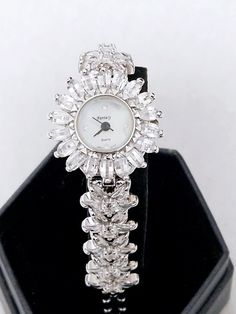 Luxury woman lady fantasy floral watch with crystal rhinestones.  Stainless steel and water resistant. Length is 20cm. Face of the watch is 2.5cm *2.5cm. Excellent quality.   Great for gift. A gift box is included. Luxury Antique Watch Accessories For Formal Occasion, Brand Watches Women, Floral Watches, Pink Watch, Gold Watches Women, Watches Women Leather, Bangle Watches, Rhinestone Fashion, Gold Long Necklace