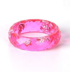 These adorable Colored Resin Rings are perfect for everyday wear. A dashing touch to your accessories and a great way to support animals at risk. You will not only receive compliments but also help to protect our wildlife. This is perfect for you, or as a gift for a loved one. Limited stock, get yours before they're gone Help us raise awareness of the threats animals face. With every Necklace sold you help saving animals across the globe! Help us Save them! Pink Resin Ring Jewelry, Resin Bangle Jewelry For Gifts, Resin Bangle Jewelry Gift, Adjustable Pink Resin Rings, Adjustable Pink Resin Jewelry, Pink Hypoallergenic Rings For Gift, Hypoallergenic Pink Rings For Gift, Nickel-free Pink Rings For Gifts, Pink Resin Bracelet Gift