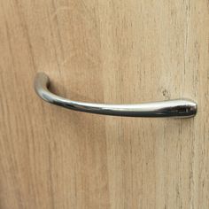 a close up of a door handle on a wooden door